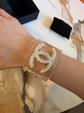 CHANEL Clear Cuff Bracelet with Pearl-Embellished Logo and Gold Trim